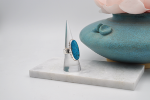 Slight side view of sterling silver Kingman turquoise ring. US Size 7.